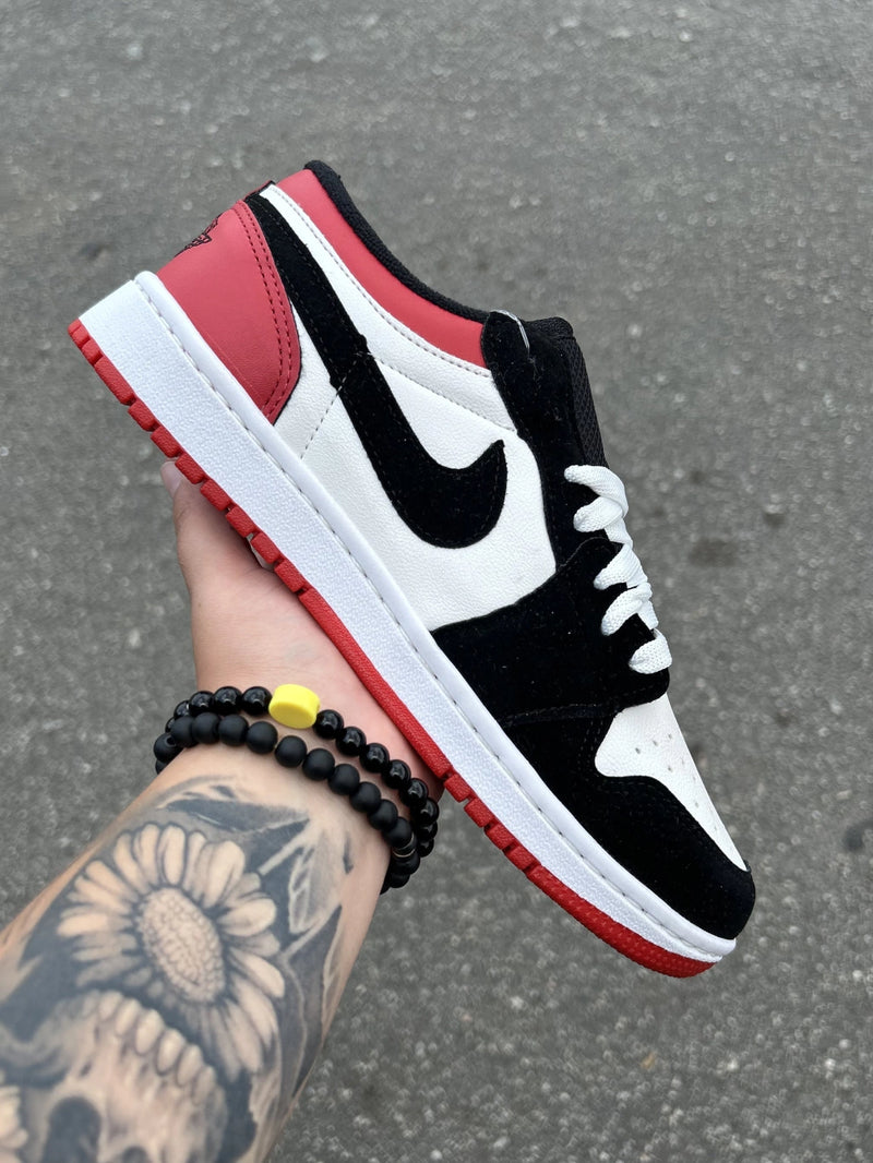 Tênis Air Jordan 1 Low Black Toe